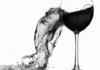 Wine Spilling Out of Broken Glass
